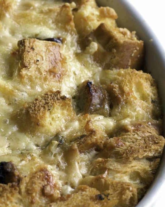 a bowl of bread pudding with raisins