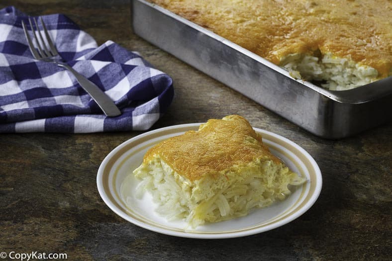 Homemade cheesy hashbrown casserole on a plate