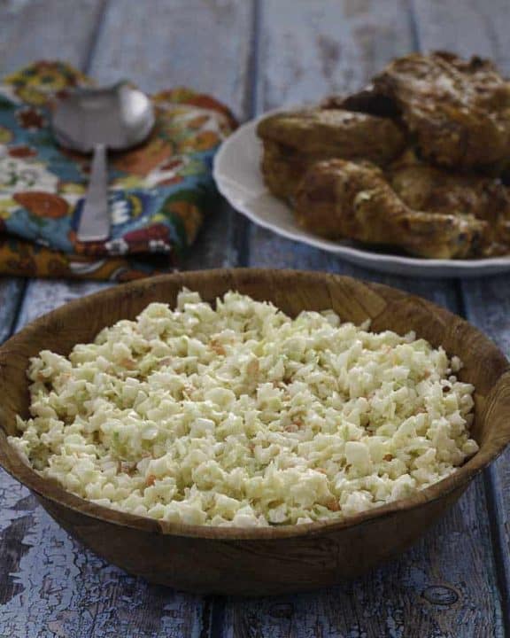 Homemade copycat KFC coleslaw in a small wood bowl.