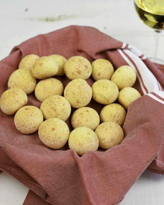 A basket filled with Brazilian cheese bread puffs