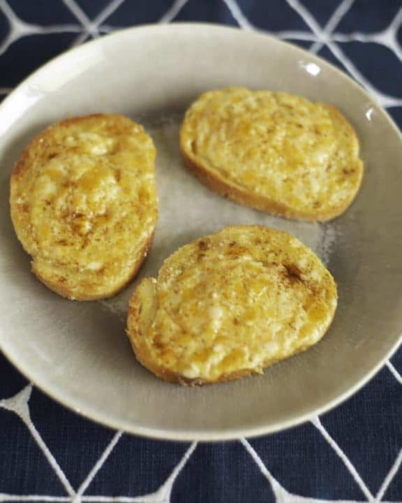 3 pieces of garlic cheese bread in a bowl