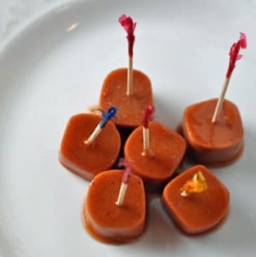 bourbon hot dogs on a plate.