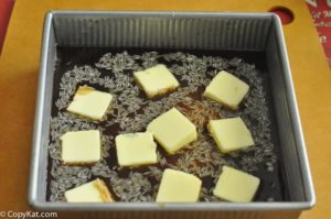 rice, French onion soup, beef consomme, butter, and Worcestershire sauce in a baking dish