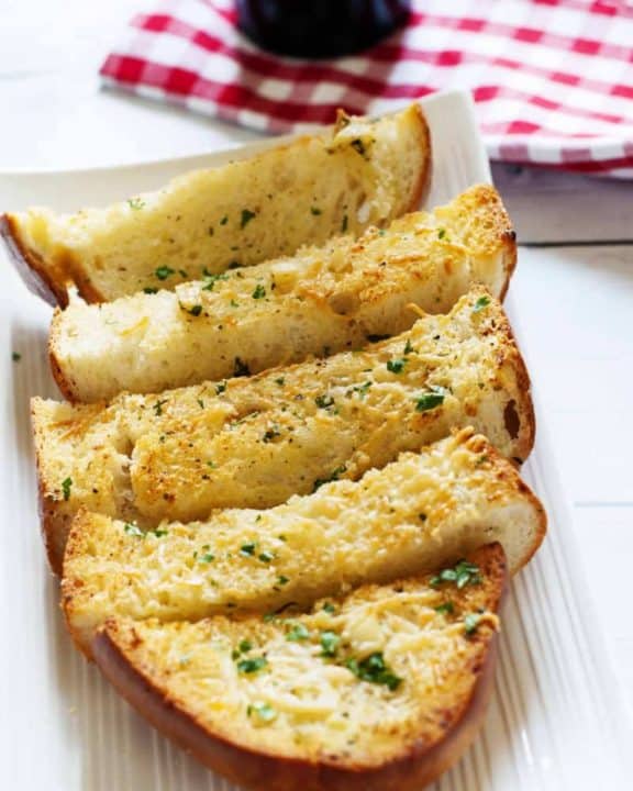 Slices of homemade Parmesan Cheese Garlic Bread on a plate