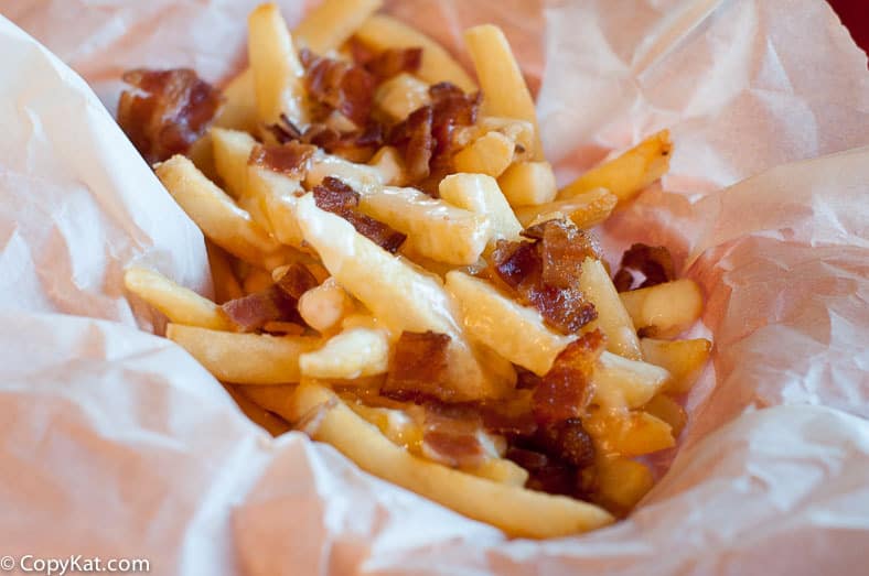 bacon cheese fondue fries on parchment paper