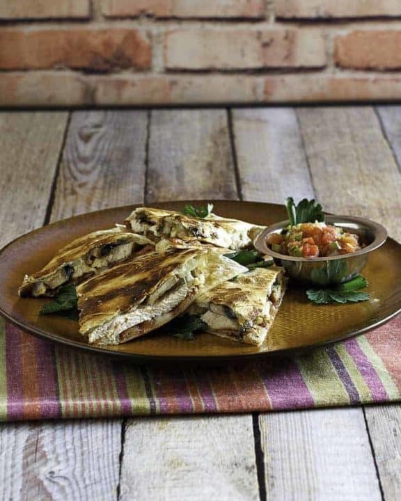 Homemade copycat Alice Springs Quesadilla on a brown plate.