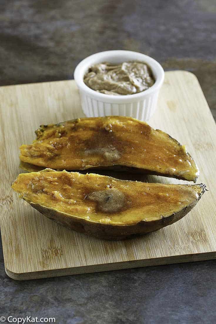Homemade copycat Outback Steakhouse Sweet Potato topped with honey butter, cinnamon, and brown sugar.