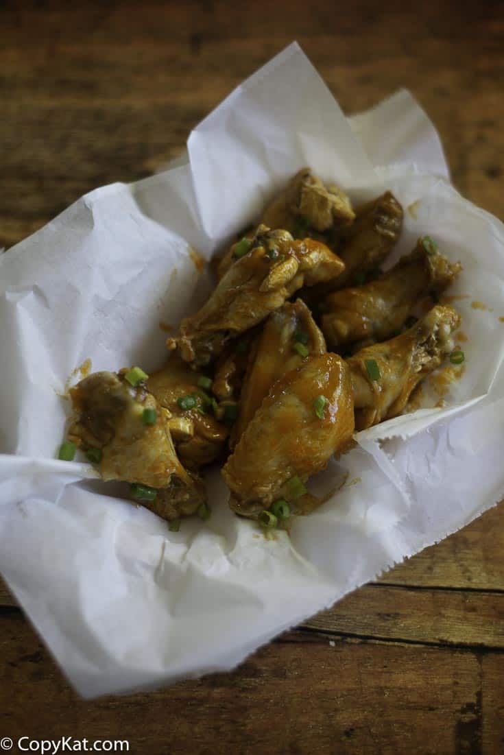 homemade garlic buffalo hot wings in a basket