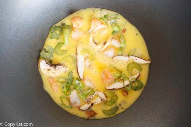 Cooking homemade Egg Fu Young in a wok.
