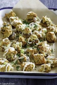 Homemade Olive Garden stuffed mushrooms in a serving dish.