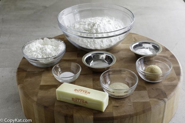 Ingredients for making a soft pretzels; all-purpose flour, bread flour- baking soda, salt, butter, and more.