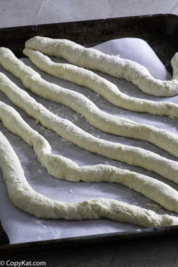 Rolling out dough to make Auntie Anne's homemade pretzels.