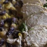 A plate of black beans, corn, and chicken that were prepared in a slow cooker.