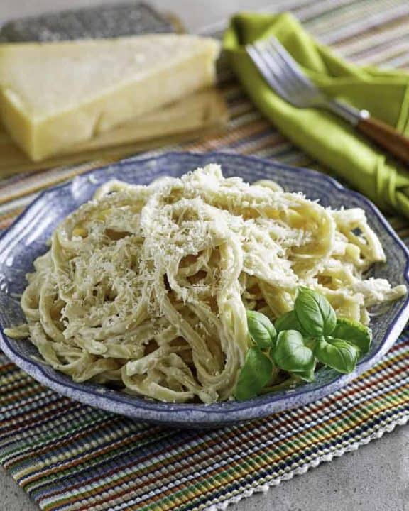 A bowl of pasta with homemade Olive Garden Alfredo sauce.