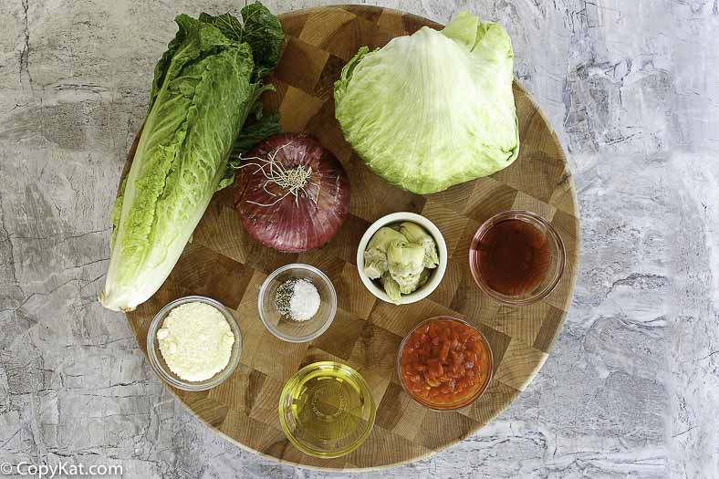 Romain lettuce, iceberg lettuce, tomatoes, red onions, and more