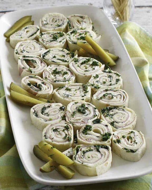 ham and cheese tortilla pinwheel roll ups on a platter