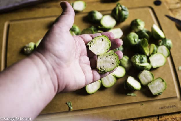 checking cut Brussel Sprout on the inside after cutting in half
