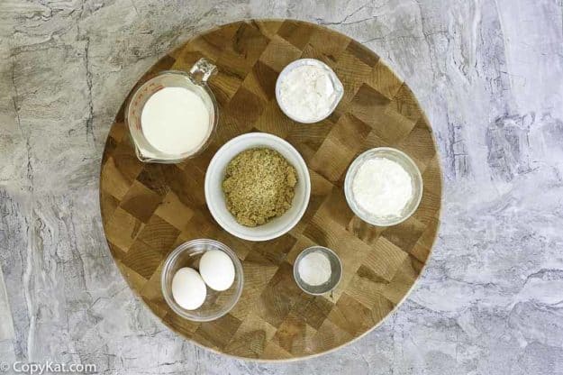 ingredients to make funnel cakes; flour, eggs, sugar, salt