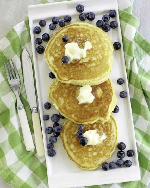 buttermilk pancakes with butter and fresh blueberries
