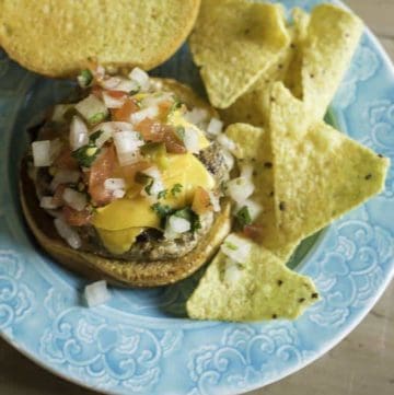 a juicy turkey burger with pico de gallo and cheese