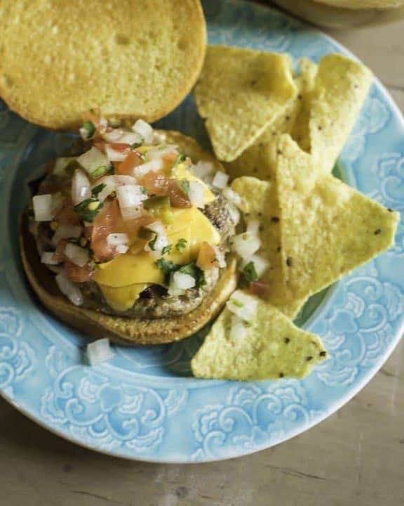 a juicy turkey burger with pico de gallo and cheese