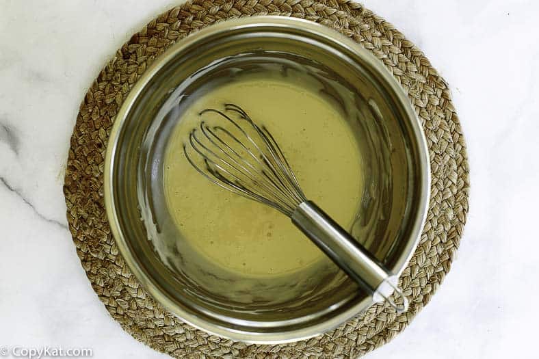 mixing together the cheesecake filling