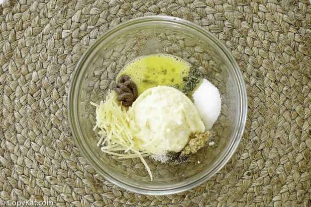 Ingredients for homemade Outback Steakhouse Caesar salad dressing in a bowl