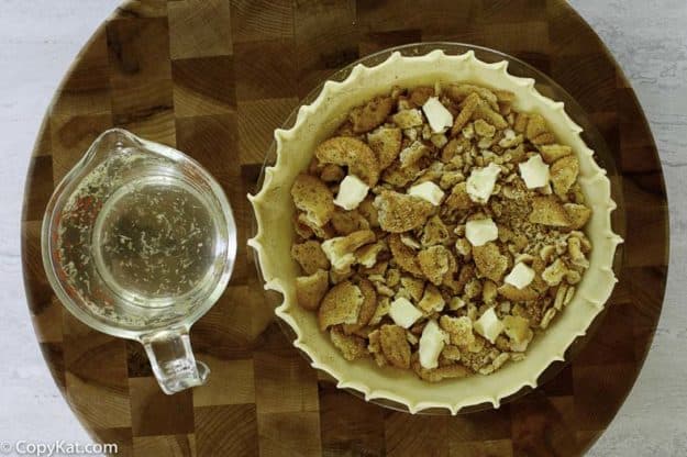 syrup and a pie shell full of broken crackers and butter