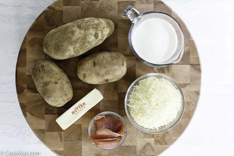 potatoes, butter, cheese, ham, and cream
