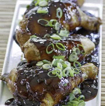 chicken shoyu with green onion slices on top
