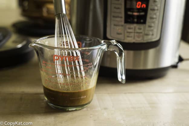 mixing stew seasoning into water.