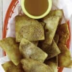 a basket of cinnamon sugar tortilla chips and honey