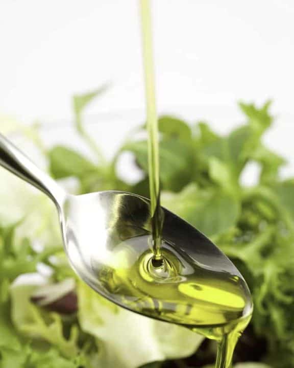 vegetable oil poured over a salad