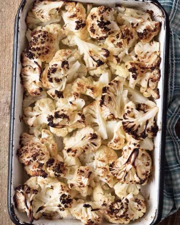 oven roasted cauliflower in a baking dish