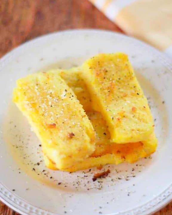 fried cornmeal mush on a white plate