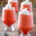 Four glasses of Jello 1-2-3 layered dessert