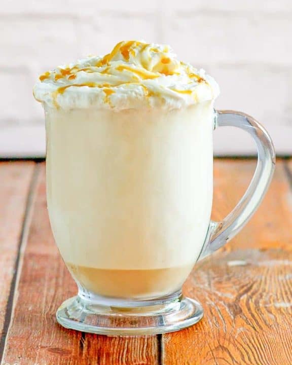 caramel cappuccino in a glass mug