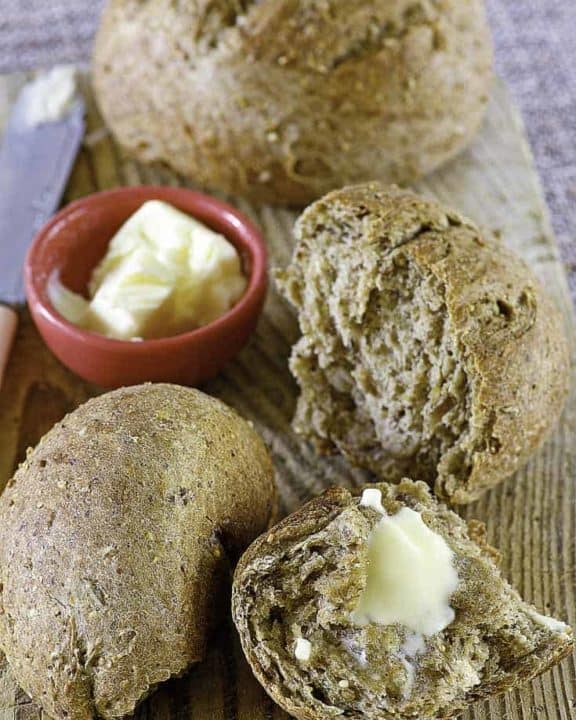 Two loaves of beer bread with soft butter