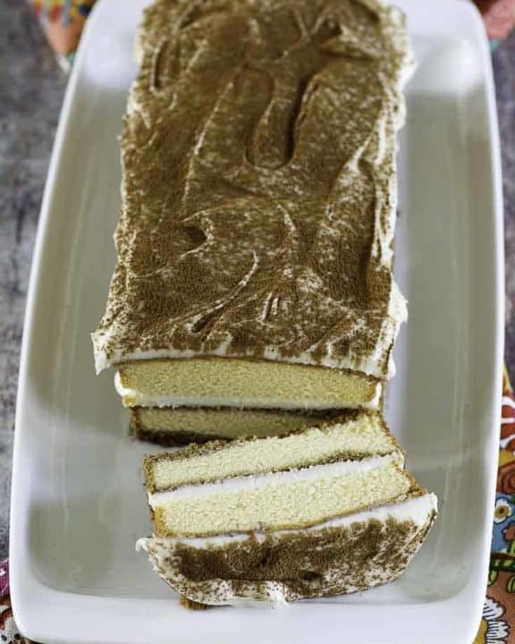a tiramisu with one slice cut