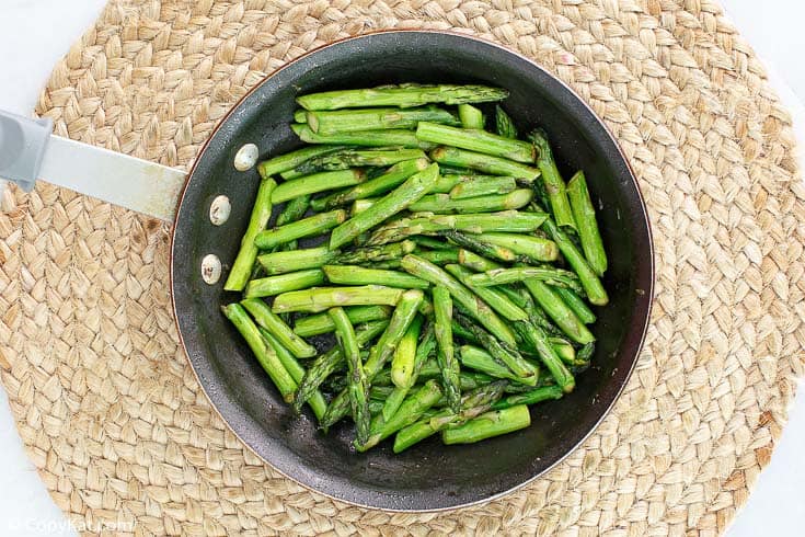 chopped asparagus in a skillet