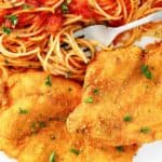 Romano cheese crusted chicken and pasta with marinara