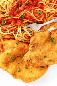 Romano cheese crusted chicken and pasta with marinara