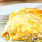 a slice of chili relleno casserole and a fork on a plate