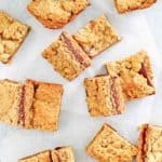 fudge jumbles cookie bars scattered on top of parchment paper