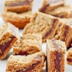 several fudge jumbles cookie bars on top of parchment paper