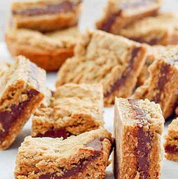 several fudge jumbles cookie bars on top of parchment paper