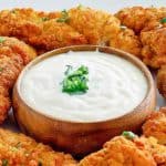 Jan sauce and fried chicken tenders on a platter