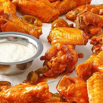 homemade Pluckers hot wings and dressing on parchment paper