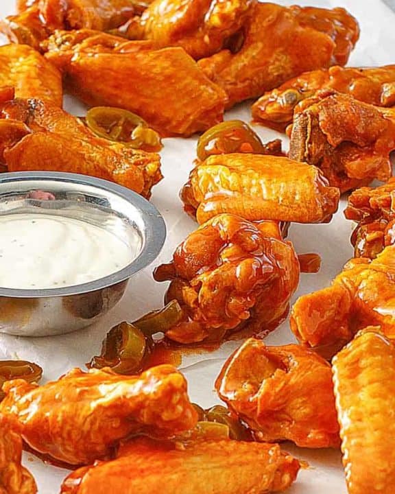 homemade Pluckers hot wings and dressing on parchment paper