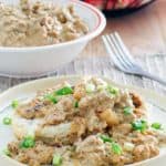 sausage gravy on biscuits and in a bowl
